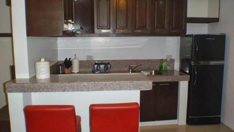 Burgundy McKinley Place Apartment in Paranaque