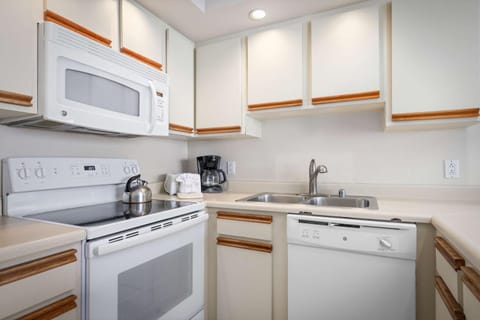 Kitchen or kitchenette, dishwasher, microwave, oven, stove, toaster