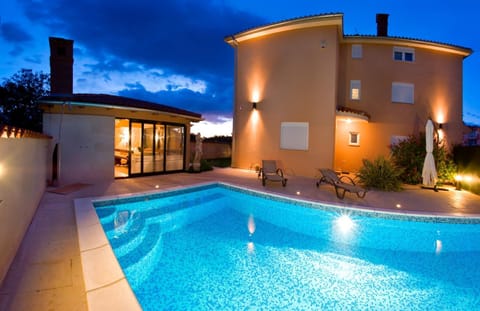 Property building, Patio, Night, Pool view, Swimming pool, sunbed