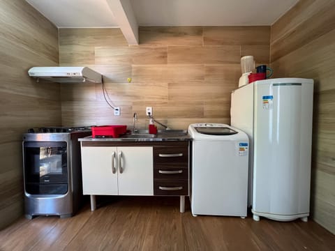 Kitchen or kitchenette, stove, washing machine