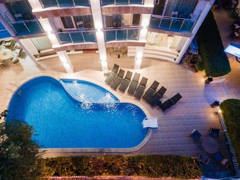 Property building, Patio, Night, Swimming pool