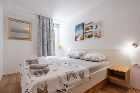 Bed, Photo of the whole room, Bedroom, towels, air conditioner