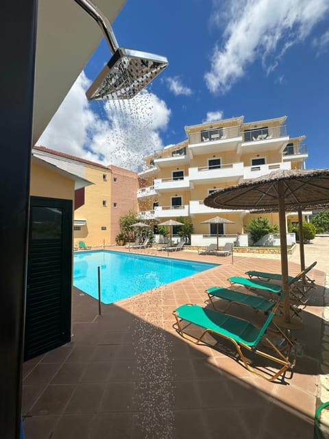 Property building, Patio, Pool view, Swimming pool, sunbed