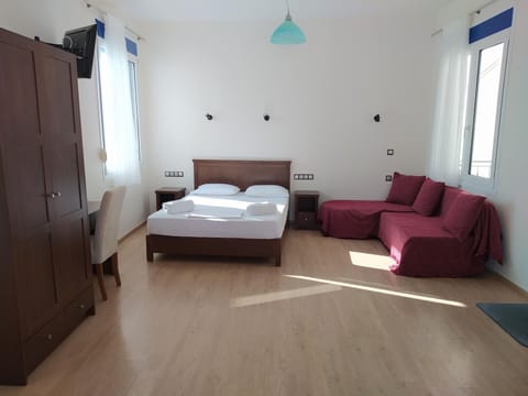 Bed, TV and multimedia, Seating area, Bedroom, towels, wardrobe