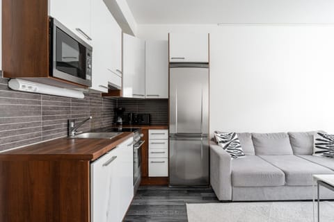 Living room, dishwasher, microwave, oven, stove, kitchen