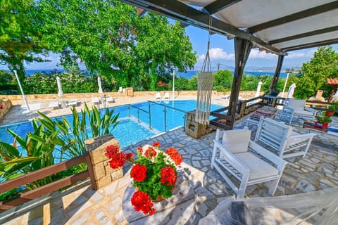 Property building, Patio, Day, Natural landscape, Garden, View (from property/room), Garden view, Pool view, Swimming pool, sunbed
