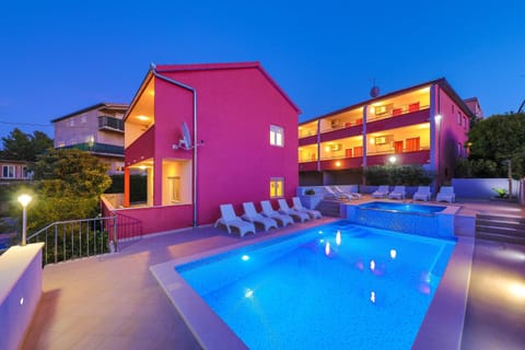 Property building, Night, Pool view, Swimming pool, sunbed