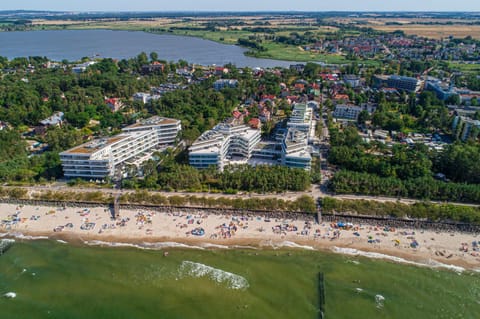 Property building, Nearby landmark, Day, Natural landscape, Bird's eye view, View (from property/room), Beach, City view, Garden view, Sea view