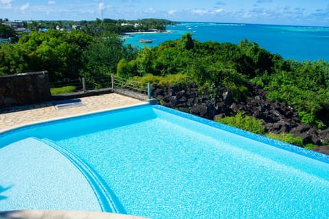 Boutique villa on the rocks with Sea, jetty, infinity pool, garden, daily housekeeping, Cook House in Mauritius