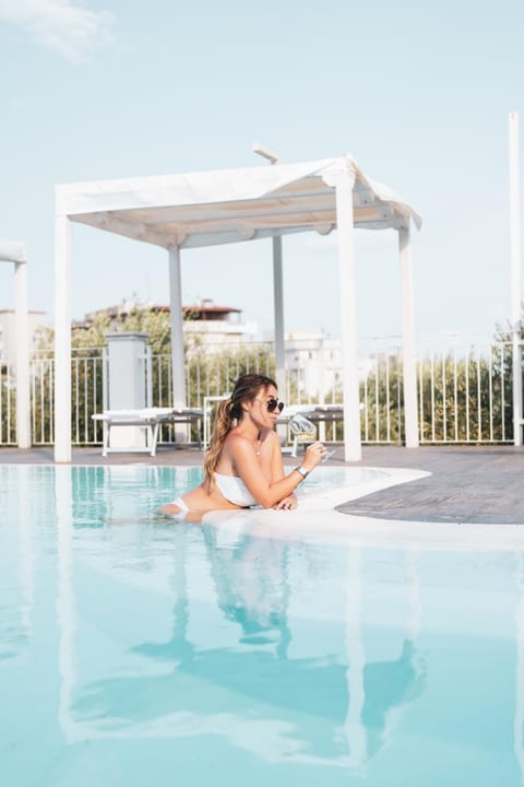 Day, People, Natural landscape, Pool view, Swimming pool, sunbed