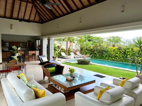 Living room, Seating area, Garden view, Pool view