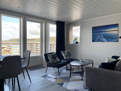 View (from property/room), Living room, Seating area, Dining area, Landmark view, Mountain view, Sea view