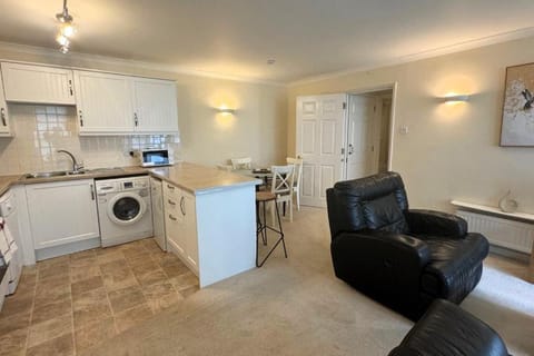 Kitchen or kitchenette, Living room, Seating area, Dining area, dishwasher, oven, stove, toaster, washing machine