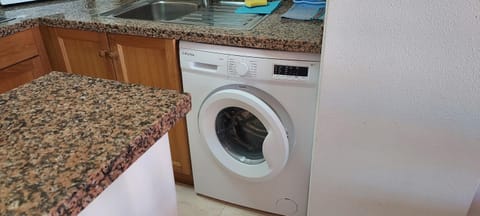 Kitchen or kitchenette, washing machine