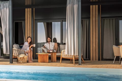 People, Seating area, Guests, Swimming pool, sunbed