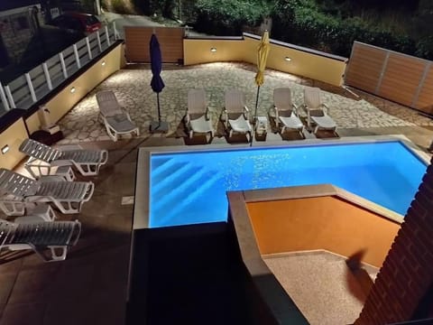 Patio, Night, Pool view, Swimming pool, sunbed