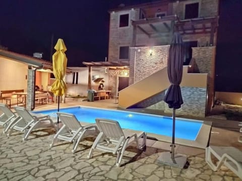 Patio, Night, Pool view, Swimming pool, sunbed