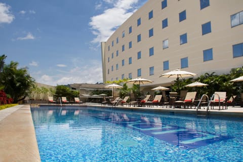 Property building, Day, Pool view, Swimming pool, sunbed