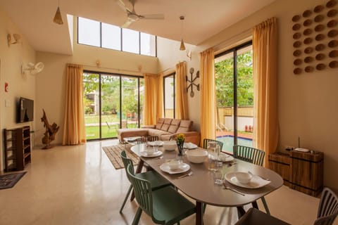 Living room, Seating area, Dining area, Garden view, Pool view