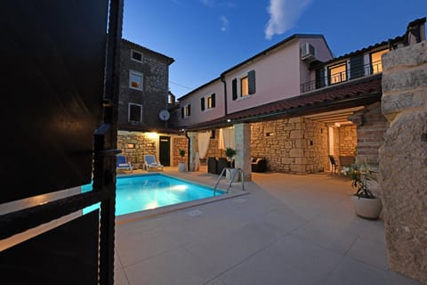 Property building, Patio, Night, Pool view, Swimming pool, sunbed