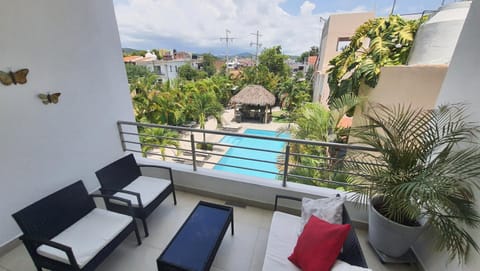 View (from property/room), Balcony/Terrace, Seating area, Pool view