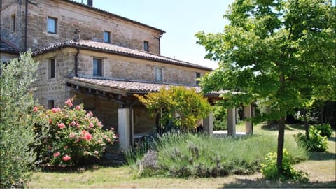 Stone farmhouse in Moie Country House in Umbria