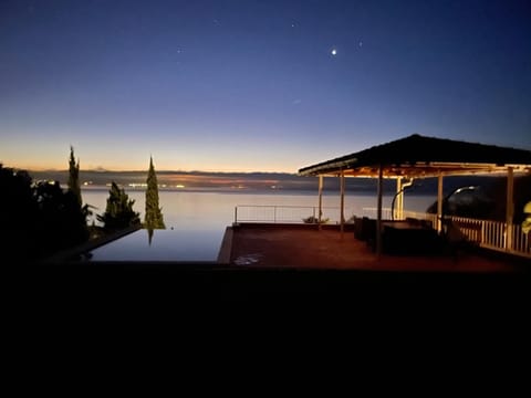 Night, View (from property/room), Balcony/Terrace, Seating area, Sea view, Swimming pool