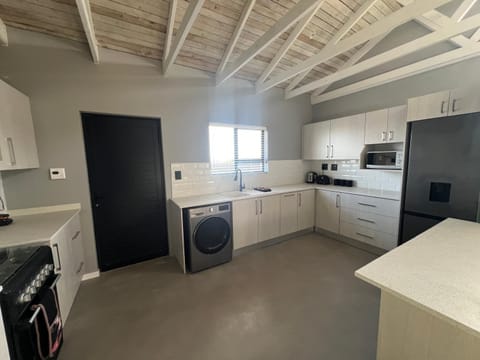 Kitchen or kitchenette, oven, stove, toaster, washing machine, dryer