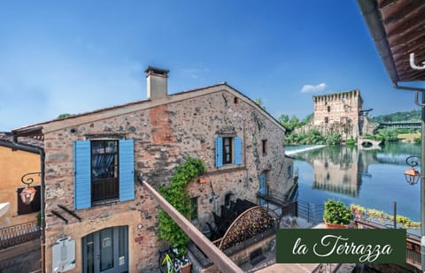 Property building, Nearby landmark, Day, Natural landscape, River view