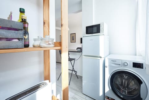 Kitchen or kitchenette, washing machine