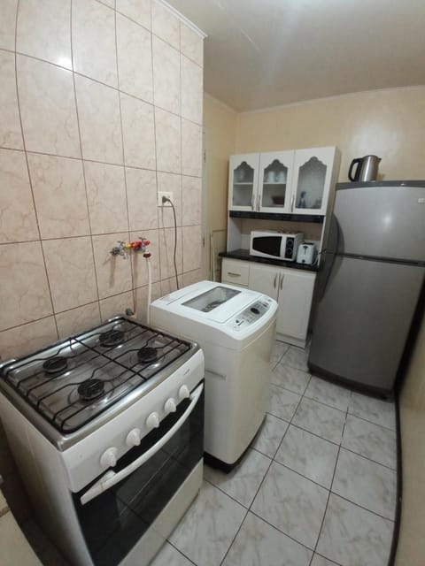 Kitchen or kitchenette, minibar, washing machine