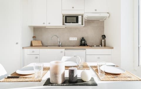 Dining area, minibar, stove, kitchen