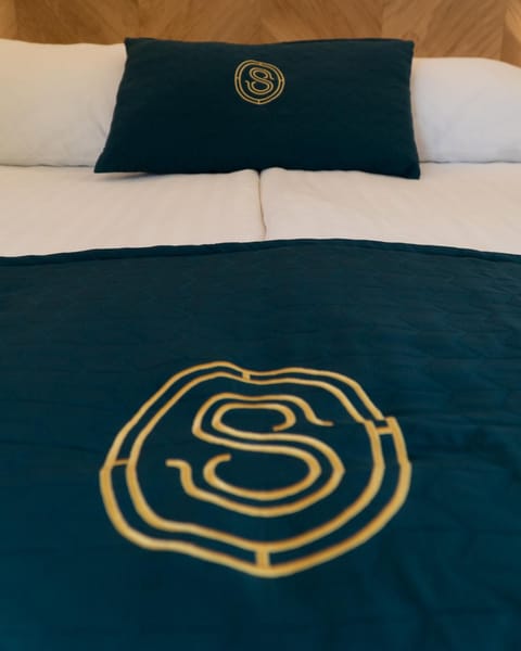 Bed, Property logo or sign, Bedroom