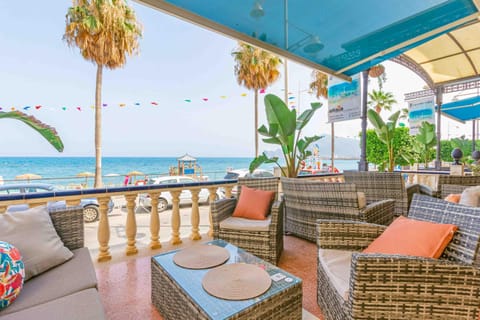 View (from property/room), Balcony/Terrace, Seating area, Beach, Sea view