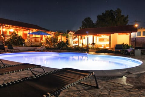 Property building, Night, Pool view, Swimming pool, Swimming pool, sunbed