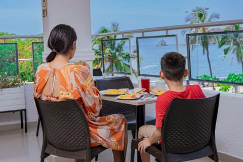 Patio, People, View (from property/room), Balcony/Terrace, Food, Guests