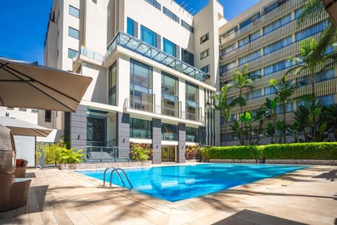 Property building, Patio, Day, Pool view, Swimming pool