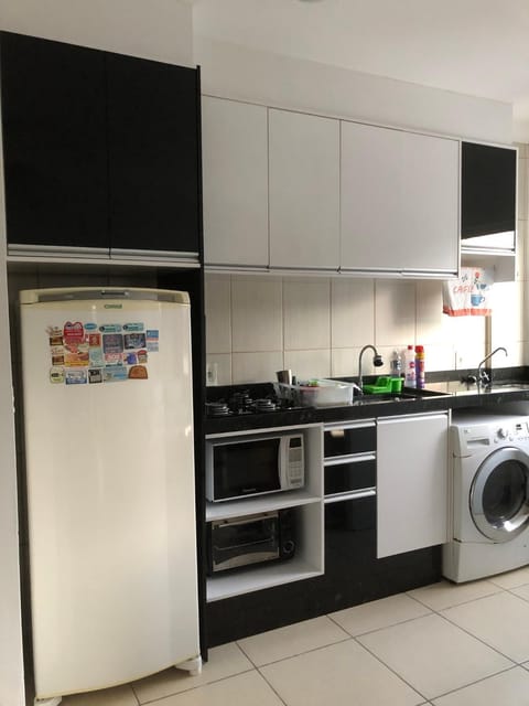 Kitchen or kitchenette, oven, stove, washing machine