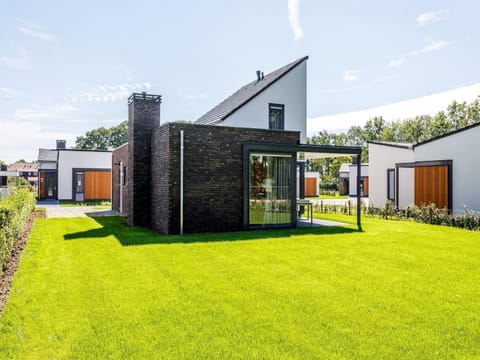 Modern and stylish villa with a fireplace in Limburg Chalet in Roggel