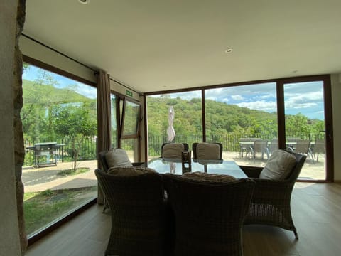 Facade/entrance, Natural landscape, Living room, Seating area, Dining area, Mountain view