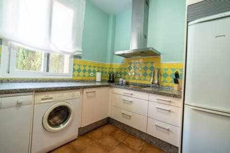 Kitchen or kitchenette, stove, washing machine