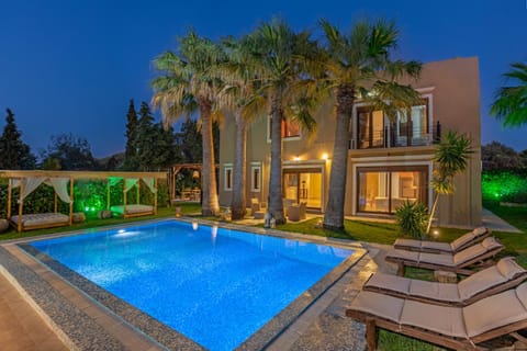 Property building, Patio, Night, Natural landscape, Garden, Garden view, Pool view, Swimming pool