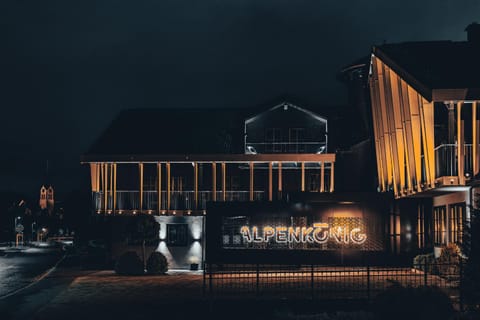 Property building, Facade/entrance, Night, Balcony/Terrace, Logo/Certificate/Sign, Text overlay