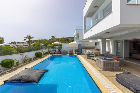 Property building, Patio, Day, View (from property/room), Balcony/Terrace, Living room, Seating area, Pool view, Swimming pool, sunbed