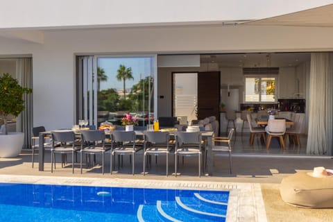 Patio, Day, Living room, Seating area, Dining area, Pool view, Swimming pool, sunbed