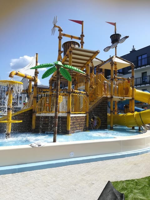 Property building, Day, Children play ground, Aqua park, Pool view, Swimming pool