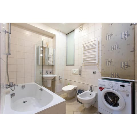 Shower, Toilet, Bathroom, Bath, bidet, towels, washing machine, dryer