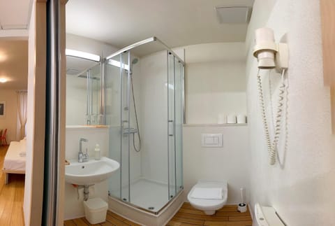 Shower, Toilet, Bathroom, hair dryier, towels