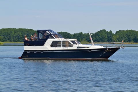 Kuhnle-Tours Hafendorf Müritz Docked boat in Rechlin