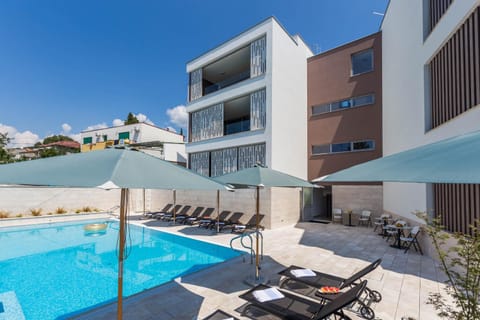 Property building, Patio, Pool view, sunbed